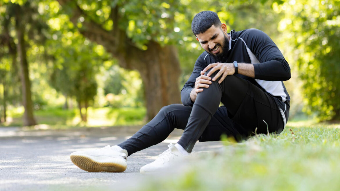 man having cramps in legs